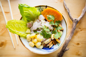 Wall Mural - Sea bass ceviche. The cebiche or ceviche is a dish consisting of fish marinated in citrus seasonings.