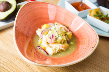 Wall Mural - Sea bass ceviche. The cebiche or ceviche is a dish consisting of fish marinated in citrus seasonings.