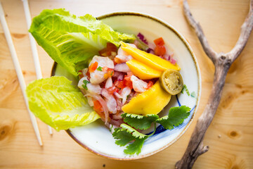 Wall Mural - Sea bass ceviche. The cebiche or ceviche is a dish consisting of fish marinated in citrus seasonings.