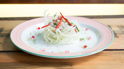 Wall Mural - Sea bass ceviche. The cebiche or ceviche is a dish consisting of fish marinated in citrus seasonings.