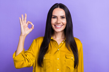 Sticker - Photo of cheerful adorable lady toothy smile wear stylish clothes arm okey symbol isolated on purple color background