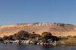 Traditional nubian village on the top of the sand hill in the bank of the Nile river with vegetation and blue clear sky
