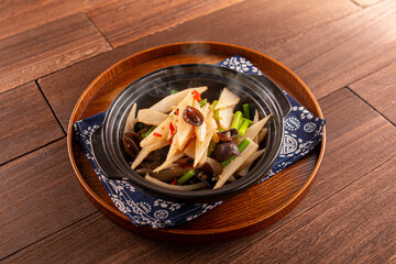 Chinese yam casserole with garlic core and black fungus served dish isolated on wooden table top view of Hong Kong food