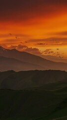 Wall Mural - beautiful sunset in the smoky mountains, caucasus, russia, timelapse. vertical video