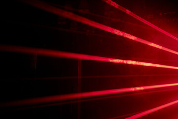 bright red neon laser lights illuminate the darkness creating lines and triangle shapes in sci-fi ef