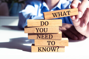 Close up on businessman holding a wooden block with 