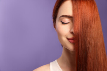 Poster - Beautiful woman with red dyed hair on purple background, space for text