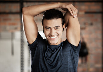 Canvas Print - Arm stretch, gym fitness and portrait of a man ready for exercise, training and wellness workout. Happy, smile and excited young person about to start sport health by stretching for sports alone