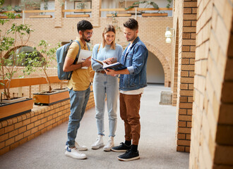 Poster - University, students and friends with textbook for project study, education or sharing information together at the campus. Group of college people reading book with smile for learning or scholarship