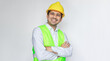 © anut21ng Stock - Portrait Smiling asian construction worker posing with arms crossed isolated white background