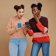 News, Wow And Shocked People Isolated On Studio Background For Social Media, Gossip Or Trendy Online Sale. Smartphone, Surprise Notification And Gen Z Friends, Black Woman Reading Announcement Mockup