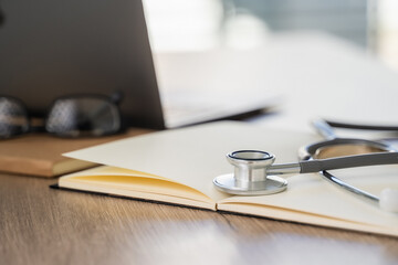 Wall Mural - Medical  healthcare  network on Computing electronic medical record. Doctor working an Laptop with Stethoscope