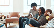 © Reese/peopleimages.com - Family with tablet, streaming and relax at family home together, spending quality time together with technology. Black people, mother and children on sofa with device, internet wifi and social media