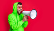 man announcer with loudspeaker isolated on red background, copy space.
