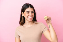 Young Italian Woman Holding A Bitcoin Isolated On Pink Background Thinking An Idea While Looking Up