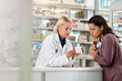 © Reese/peopleimages.com - Consulting customer and focus of store pharmacist at counter for expert help and customer service. Pharmaceutical advice and opinion of worker helping girl with medicine information at pharmacy.