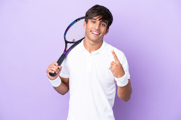 Wall Mural - Handsome young tennis player man isolated on ocher background doing coming gesture