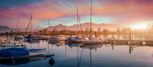 Scenic Nature Landscape. Sunrise On Chiemsee With Vivid Sky. Sailboats In The Harbor On A Summer Evening In The Sunset. Beautiful Alpine Summer View Near Rimsting At Famous Chiemsee, Bavaria, Germany