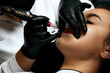 Beauty master making lip permanent powder makeup