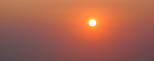 Wall Mural - disk evening sun orange sunset. evening sky sun background