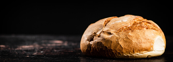 Poster - Fresh fragrant bread on the table. 