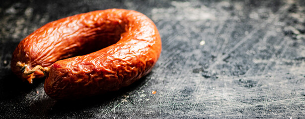 Canvas Print - Delicious salami sausage on the table.