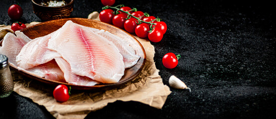 Poster - Fresh fish fillet on a wooden plate. 