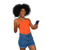 © Edson Souza - positively surprised young woman celebrates, holds a smart phone in one hand, black power afro style hair
