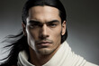 © Fantasy22 - Close-up portrait of a handsome young hispanic / latino man with long windswept hair on a dark background - not based on a real person, Generative AI