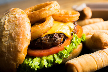 Wall Mural - Authentic top quality American Burger with fried onion rings and cheese.