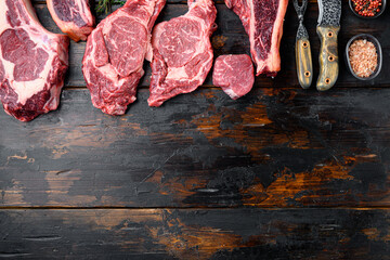 Wall Mural - Set of Fresh raw marbled beef steaks, tomahawk, t bone, club steak, rib eye and tenderloin cuts, on old dark  wooden table background, top view flat lay, with copy space for text