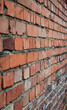 © 151115 - Red brick wall. City buildings. Brick background. Repair, construction. Weathered stained old brick wall background.
