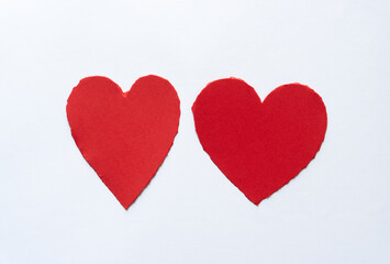 Sticker - two hearts with torn edges on a white background