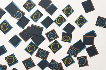 Sticker - group of random black paper squares with circle patterns  though some are blank