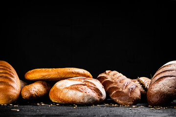 Wall Mural - Different types of fresh bread on the table. 