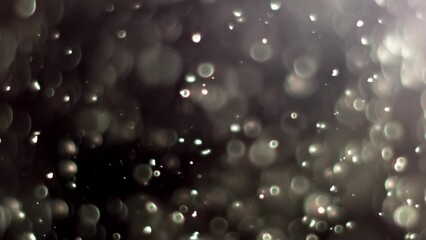Wall Mural - Abstract background with animation of flying and flickering particles as bokeh of light. Animation of seamless loop.Dust bubbles snow animation.Bokeh Shiny Particles Loop Animation.