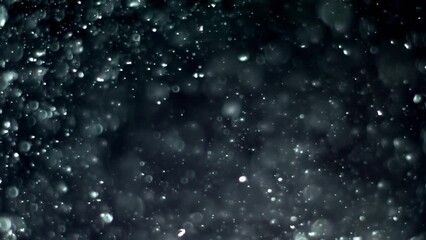 Wall Mural - Abstract background with animation of flying and flickering particles as bokeh of light. Animation of seamless loop.Dust bubbles snow animation.Bokeh Shiny Particles Loop Animation.