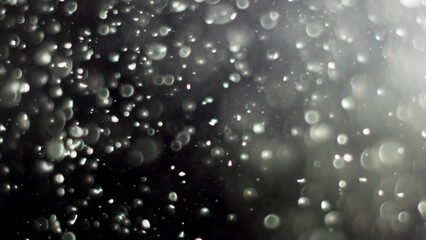 Wall Mural - Abstract background with animation of flying and flickering particles as bokeh of light. Animation of seamless loop.Dust bubbles snow animation.Bokeh Shiny Particles Loop Animation.