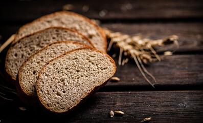 Wall Mural - Slices of sliced bread on a table with a spike. 