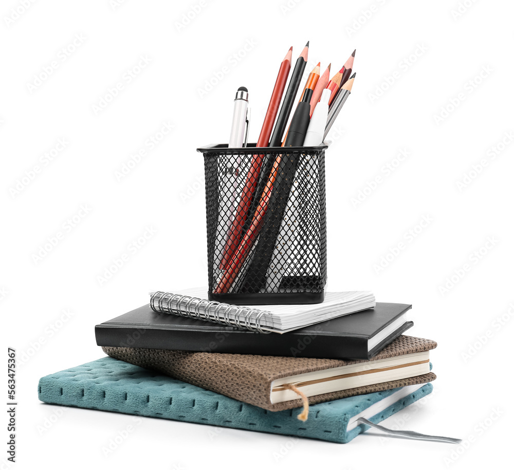 Stationery holder with notebooks on white background