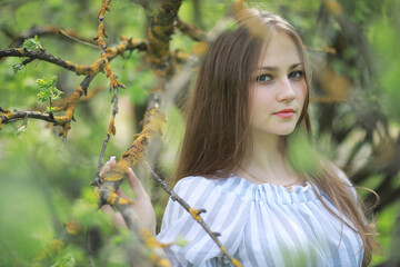 A girl in a spring green park