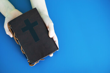 Wall Mural - Book with the symbol of the cross. Bible study. Religious book. Prayer.