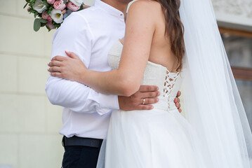 Wall Mural - wedding flowers in the hands of the bride and groom. concept for event agencies