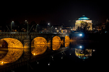 Turin by night, Vittorio Emanuele I bridge on Po river in front Gran Madre di Dio's Church