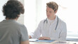 © stockbakers - Young Doctor Talking with Patient in Clinic, Treatment