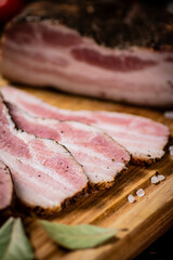 Sticker - A delicious homemade piece of lard on a cutting board. 