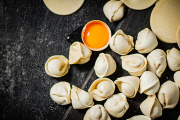 Sticker - Dumplings with raw egg and pieces of dough. 