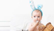 Newborn Baby Girl In A Rabbit Ears. Easter Holiday