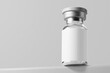 © Regi Munandar - antivirus covid-19 vaccine glass vial medicine bottle realistic mockup with blank label template in perpective bottom view 3d rendering illustration