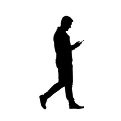 Silhouette of a man using a cell phone